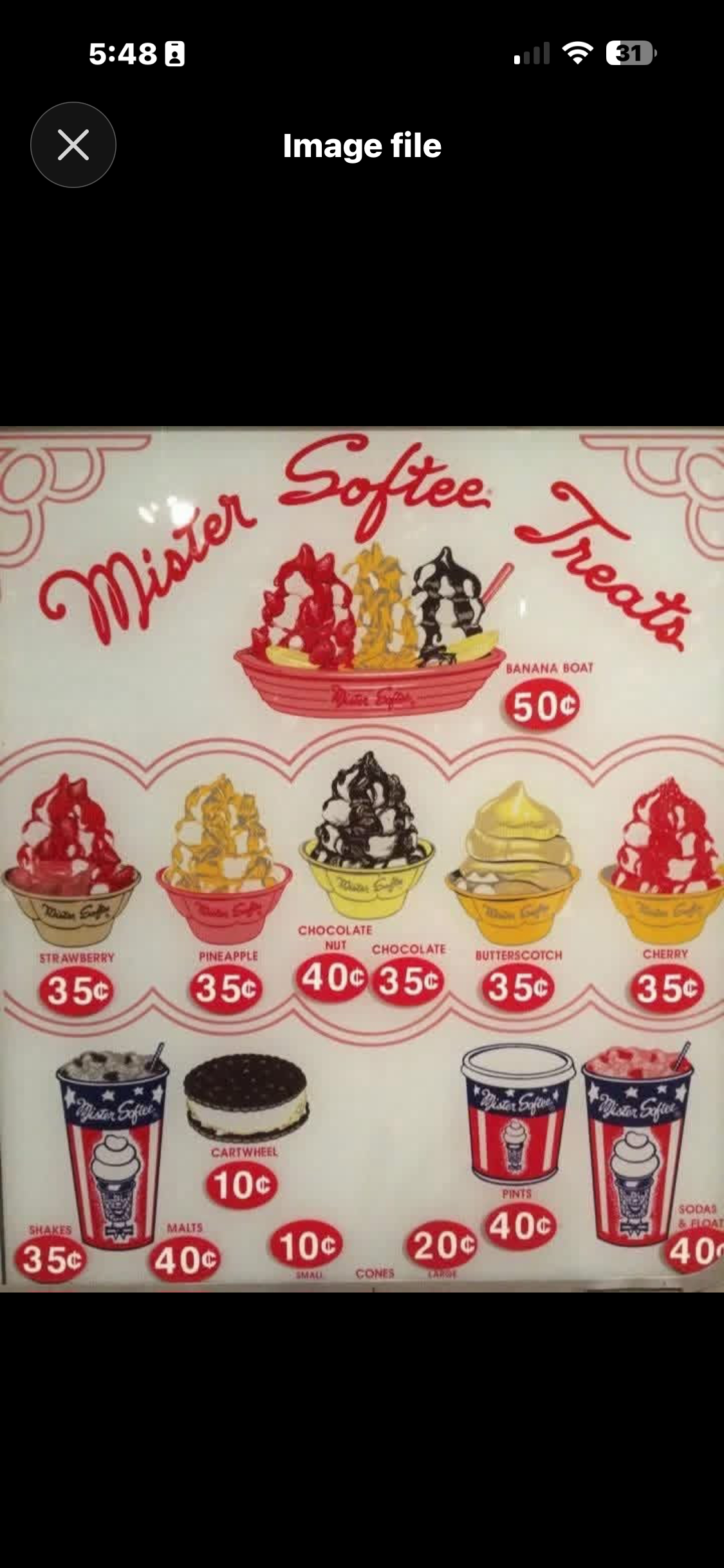 Vintage Mister Softee board used to check ice cream cone cost then and now